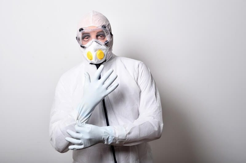 a person with mask and disposable gloves